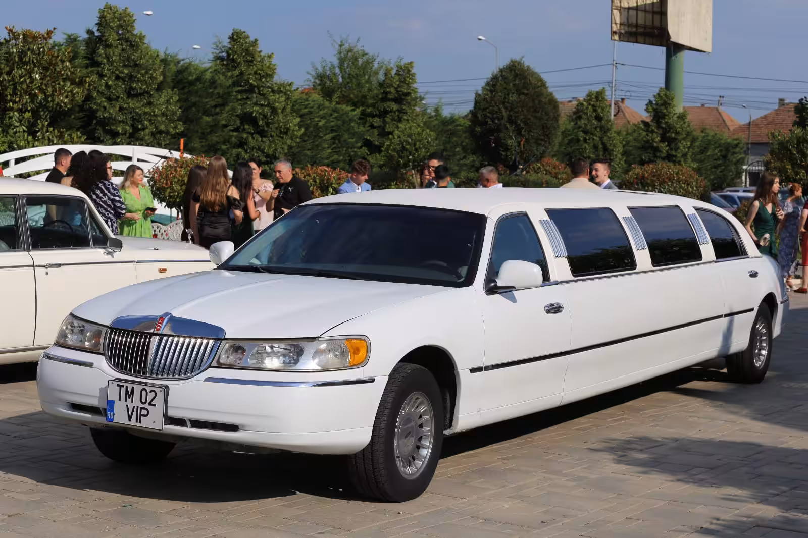 a white limousine parked on a street